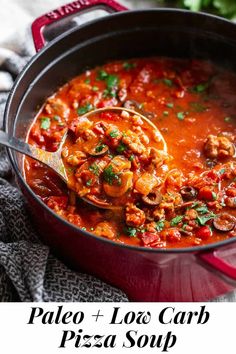 a red pot filled with pasta and meat