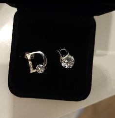 Trendy and Unique pair of D logo Moissanite Diamond Stud earrings come to 1 carat in total weight and in Sterling silver Setting with the larger D logo featuring 3 side smaller stones & a Moissanite diamond Solitaire at the base ,  the smaller D logo stud features a Solitaire also at it's base but has the slightly larger stone at it's base. Passed the diamond tester as Diamond on Diamond selector II  (  These may or may not have a 925 Stamp due to the Unique Setting & custom shape ) . Aaa Quality Silver Diamond Earrings In Cubic Zirconia, Aaa Quality Silver Diamond Earrings For Anniversary, Aaa Quality Silver Diamond Earrings, Sterling Silver Diamond White Earrings, Aaa Quality Diamond White Sterling Silver Earrings, Logo D, D Logo, Diamond Tester, Diamond Stud Earrings