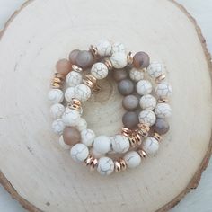 "Gold and white beaded stretch bracelet set. Set of 3 gold and white beaded stretch bracelet set.   gemstone boho bracelet set with a mix of white beads with gold accents and  druzy geode bead accents. Bracelets are made to order . small measures approximately 6.5 \" Med approximately  7.5\" (which would fit an average size wrist and most often ordered) Large approximately 8.5\"  If you are unsure what size to order use a soft measuring tape to wrap around your wrist to measure . Or you can take Bracelets Pretty, Unique Hoop Earrings, Multi Gemstone Bracelet, Stone Bracelets, Classic Bracelets, Pretty Bracelets, Minimalist Bracelet, Large Hoop Earrings, Tampa Fl