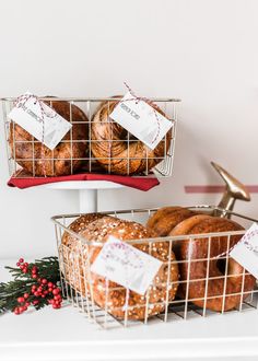 two baskets filled with baked goods sitting on top of a counter