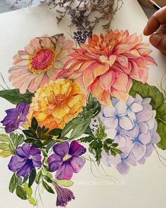 a person is drawing flowers with colored pencils