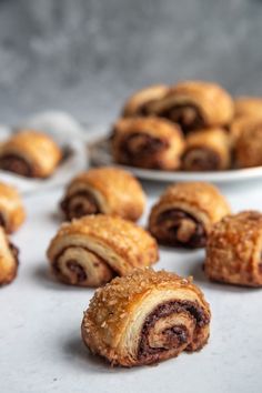 several pastries sitting on top of a white table