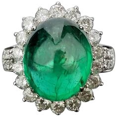 A very elegant Zambian Emerald cabochon of good quality and beautiful colour, and White Diamond cocktail ring, all set 18K white gold. Stone Details: Stone: Zambian Emerald Carat Weight: 8.35 Carat Diamond Details: Total Carat Weight: 1.43 carat Quality: VS/SI , H/I 18K Gold: 8.03 grams The ring can be resized upon request. The ring can be certified upon request. Etsy Jewelry Rings, Art Deco Emerald, Emerald Cabochon, Sapphire Cocktail Ring, Handmade Jewelry Ring, Diamond Cocktail Ring, Gold Jewelry Sets, Gold Cocktail Ring, Diamond Jewelry Designs