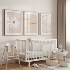 a baby's room with two pictures on the wall, a crib and toys