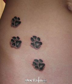 an image of a dog paw prints on the back of a woman's stomach