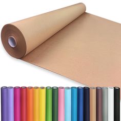 a roll of paper with different colors and sizes on it next to rolls of colored papers