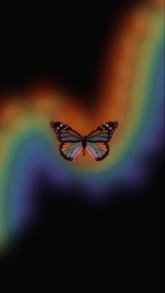 a colorful butterfly flying over a black background with the words, 22 2 entradas para