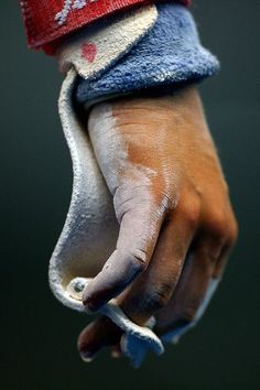 black and white photograph of a person's hand with a towel on top of it