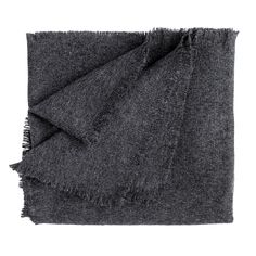 a black blanket with fringes on it