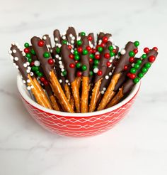 a bowl filled with pretzels and candy canes