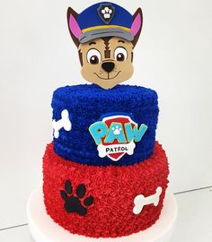 a dog cake with paw patrol on top