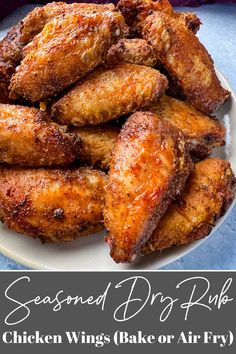 fried chicken wings on a white plate with text overlay that reads seasoned dry fry chicken wings bake or air fry