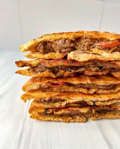 a stack of food sitting on top of a white table