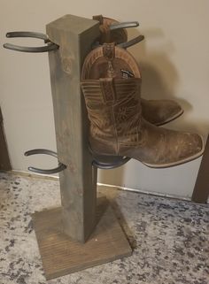 A boot tree to hold up to 4 pairs of boots! A space saver only taking up 1 square foot of floor space! Real horseshoes used to hold your boot straps. Boot Rack For Cheyenne Local Deliveries Please contact Seller** To view color options, please visit: https://www.thehatrackguy.com/gallery 26" tall 11" Floor Space Cowboy Boot Rack, Horseshoe Boot Rack, Boot Hanger, Cowboy Hat Rack, Boot Holder, Welding Design, Boot Tree, Horseshoe Projects, Pallet Crates