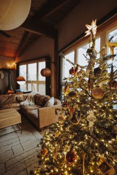 a decorated christmas tree in a living room