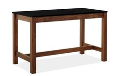 a wooden table with a black top