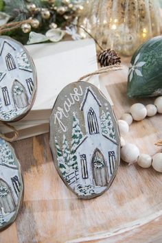 some ornaments are sitting on a wooden table