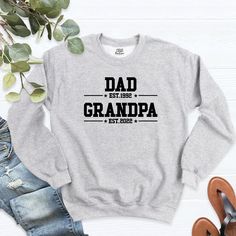 Dad Est Grandpa Est Sweatshirt, Custom Dad Grandpa Sweatshirt, Gift For Grandpa, Daddy Papa Grandfather Tee, Father Day Hoodie, Grandpa Tee. Welcome to our store! -We specialize in funny, customizable apparel shirts in different colors and styles printed on ultra-soft, super comfortable, and breathable material. -Solid colors 50/50 Preshrunk Cotton/Polyester -We use Gildan - Heavy Blend and one of the best quality products on the market. If there are personal designs you want, we can make custom Father's Day Letter Print Relaxed Fit Sweatshirt, Father's Day Relaxed Fit Letter Print Sweatshirt, Father's Day Letter Print Sweatshirt, Casual Crew Neck Sweatshirt For Father's Day, Gray Fleece Tops With Letter Print, Long Sleeve Top With Text Print For Father's Day, Winter Crew Neck Sweatshirt With Name Print, Father's Day Casual Sweatshirt With Name Print, Grandpa Shirts Vinyl