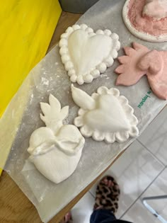 four different shaped cookies sitting on top of a counter