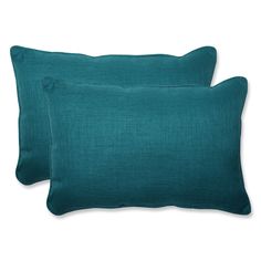 two teal pillows on white background