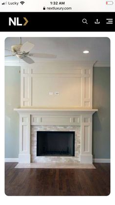 an empty fireplace with white paint and wood floors