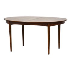 an oval wooden table with two leaves on the top and one leaf at the bottom