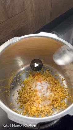 a pot filled with food sitting on top of a stove