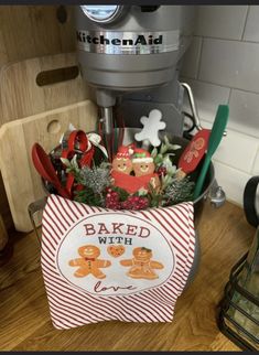 a basket filled with kitchen utensils on top of a counter