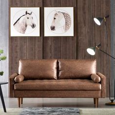 a living room filled with furniture and pictures on the wall