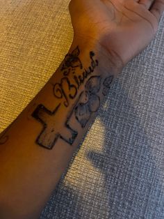 a person's arm with a tattoo on it that says faith and an elephant