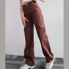 Fabricated with polyester, this garment features a secure zipper closure and a mid-rise waist. DETAILSMaterial: PolyesterClosure Type: Zipper FlyWaist Type: Mid Pants With Lots Of Pockets, Celana Kargo, Cargo Pants Streetwear, Match Three, Chique Outfit, Trousers Casual, Baggy Trousers, Liberia, Lots Of Pockets