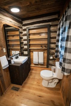 a bathroom with wooden walls and flooring