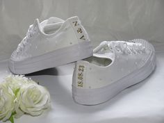 Romantic and elegant, our personalised white pearl wedding Converse are perfect for brides on the big day.  Whether you choose wedding sneakers for the whole event or opt for heels for the ceremony and a change into wedding Converse to dance the night away, you can be confident of comfort and style in our bridal Converse sneakers. Custom hand embellished with white pearls and finished with Grade A diamante sliders and white satin ribbon. Personalised back strips in glitter print on your choice of colour for that final finishing touch.  Ribbon colour can be changed to compliment your colour theme. Please just ask. Wedding Trainers, Bride Converse, Bride Sneakers, Converse Wedding, Bridal Converse, Wedding Converse, Wedding Socks, Wedding Sneakers, Converse Trainers