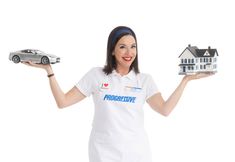 a woman holding a model house and a car in front of her with the words progressive on it