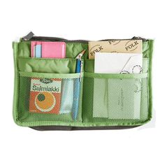 an open green purse filled with lots of items