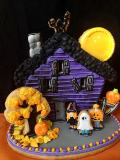 a decorated halloween house with pumpkins and decorations