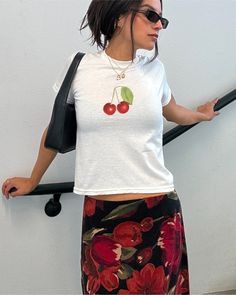 Our retro inspired cherry tee is perfect for casual summer outfits! All of our baby tees are digitally printed on 100% cotton and shrunken for a 90s style baby tee look. Pair with high waisted vintage levis for a casual look or with a vintage printed midi skirt for a casual evening outfit!  🍒 DETAILS 100% cotton Youth tees - these are small, shrunken t-shirts, not crop tops! Unisex Lightweight DTG - digitally printed  Ribbed collar Shoulder-to-shoulder taping Tubular seam construction Blank tee Trendy Crew Neck T-shirt With Cherry Print, Trendy Summer Tops With Cherry Print, Trendy Cherry Print Tops For Summer, Vintage Summer Top With Fruit Print, Vintage Fruit Print Top For Summer, Y2k Cherry Print Summer Tops, Casual Cherry Summer Tops, Vintage Fruit Print Crew Neck Tops, Retro Spring Tops With Strawberry Print