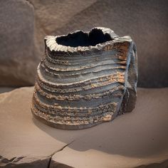 a piece of pottery sitting on top of a table