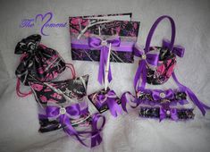 purple and black gift boxes with bows on them