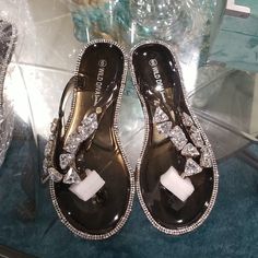 Black And Jeweled Flip Flops Black Flat Sandals For Party, Designer Black Flip Flops For Beach, Black Luxury Flip Flops, Luxury Black Flip Flops With Single Toe Strap, Slip-resistant Black Flip Flops For Vacation, Black Rhinestone Flip Flops For Beach, Clear Chunky Heels, Strap Sandals Flat, Bling Flip Flops