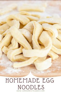 homemade egg noodles on a cutting board with text overlay that reads homemade egg noodles