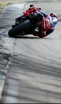 a person riding a motorcycle on a race track