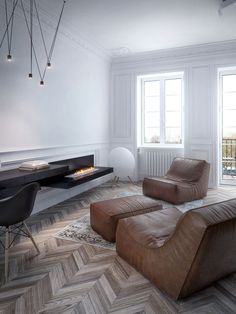 a living room filled with furniture and a fire place next to a wall mounted tv