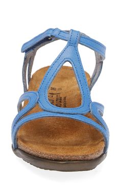 A graceful teardrop modifies a breezy T-strap sandal finished with a slim hook-and-loop strap closure. Flat sole American Podiatric Medical Association (APMA) Seal of Acceptance Leather upper and lining/rubber sole Imported Adjustable Blue Sandals With Arch Support, Blue Leather Sandals With Arch Support, Blue Sandals With Heel Loop And Single Toe Strap, Spring T-strap Sandals With Arch Support, Leather T-strap Sandals With Arch Support, Blue Adjustable T-strap Sandals, Adjustable T-strap Sandals With Arch Support, Blue Sandals With Cushioned Footbed And Single Toe Strap, Black Raven