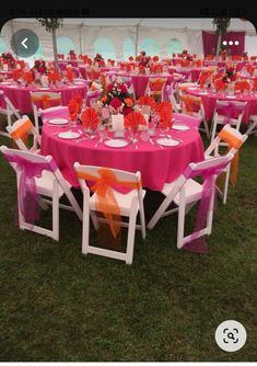 an outdoor event with tables and chairs covered in pink cloths, orange bows and flowers