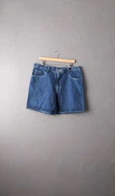 These aren't quite Burt Reynolds short, but these are one of the shorter pairs of denim shorts I have in stock at the moment! In a nice mid blue denim wash. 100% cotton Labelled a size W38, these fit a 33-35 (84-89 cm) waist, but given the elastic waist, these could also fit a Small. Garment Measurements: Waistband= 38 inches (97 cm) Hips= 47 inches (119 cm) Rise= 12 inches (30 cm) Inseam= 7 inches (18 cm) In great vintage condition- very slightly faded from washing over the years, but otherwise no flaws. Affordable Vintage Men's Jean Shorts, Relaxed Fit Denim Blue Jean Shorts, Cotton Jean Shorts Dark Wash Short Leg, Dark Wash Cotton Jean Shorts, Denim Shorts Y2k, Y2k Beach, Vintage Jean Shorts, Shorts Y2k, Vintage Denim Shorts