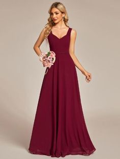 a bridesmaid in a long, deep red dress with a v - neckline