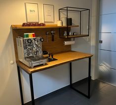 a coffee machine sitting on top of a wooden table