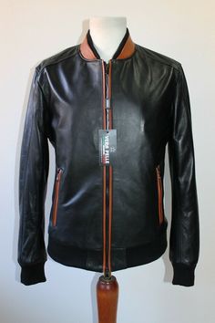 ITALIAN LAMBSKIN LEATHER BOMBER JACKET. MADE WITH  SOFT LAMBSKIN  LEATHER . COLOR : BLACK AND TAN SIZE : XL (slim fit)   , for more details of the measures please check photo #4 MADE IN ITALY    We've done our best to represent our true colors but due to the differences in screen resolution for computer monitors, colors can vary slightly. MATERIAL  All our skins are tanned in  Solofra Italy, the town of 200 lambskin tanneries. We Guaranty 100% the quality of what we are selling.   LOOKING FOR SO Computer Monitors, Leather Jackets, Lambskin Leather, Black Tan, Black And Tan, True Colors, Vest Jacket, Tracking Number, Soft Leather