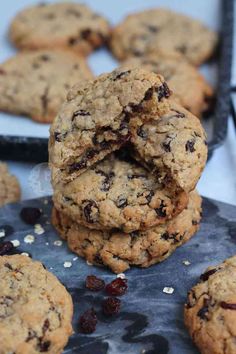 cookies stacked on top of each other with cranberries and oats in the middle